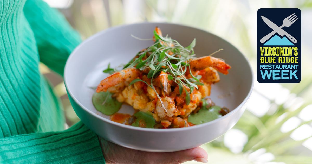 hands holding a bowl of food with VBR restaurant week logo in the right corner